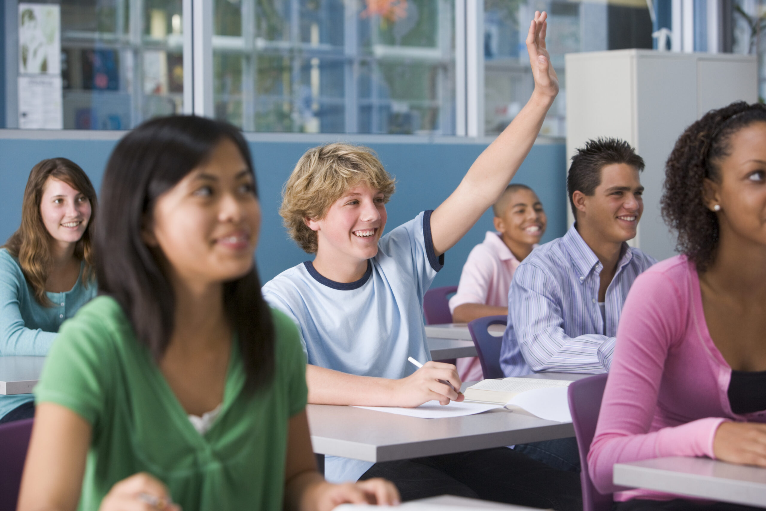 School children in high school class listening to lecturer